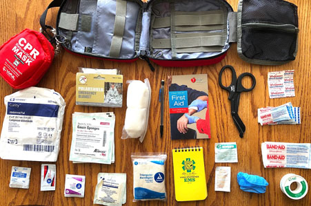 A well-stocked medicine cabinet featuring bandages, antiseptics, pain relievers, and other first aid essentials for home care.